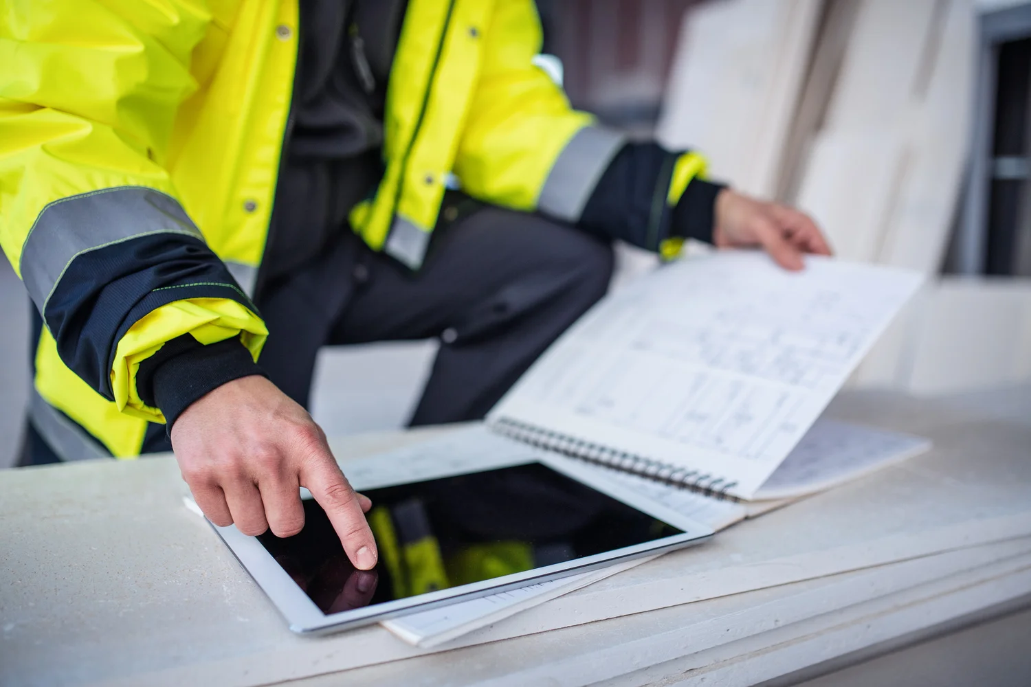 General contractor reviewing blueprints for an office remodel